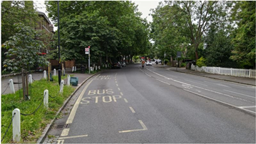 Bus stop on a leafy quiet road